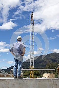 Bridge builders swing in another beam