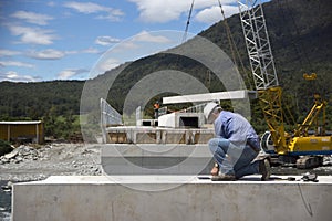 Bridge builders swing in another beam