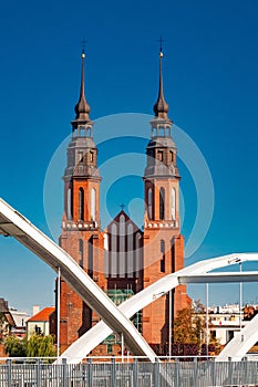 bridge close-up over the Odra river and Cathedral of the Exaltation of the Holy Cross in Opole, Poland