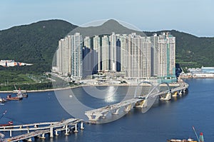 Bridge in construction and high rise residential building in Hong Kong city