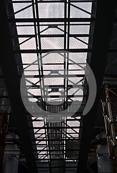 Bridge construction. Metal mesh framework of the bridge