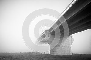 Bridge consumed in dense fog