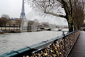 Bridge Covered in Padlocks Next to River, A Symbol of Eternal Love and Connection, A love lock bridge over the river Seine with