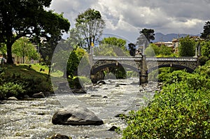 A bridge crossing a river in Cuenca, Ecuador