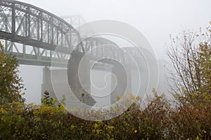 Bridge disappears in the fog