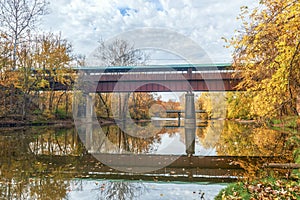 The Bridge of Dreams is a covered Bridge spanning over Mohican river in autumn