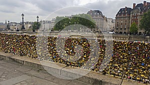 Bridge fence in paris with padlocks