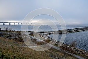 A bridge in fog. Blue ocean and mist in the background. Picture from the bridge connecting Sweden with Denmark