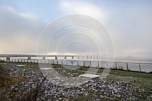 A bridge in fog. Blue ocean and mist in the background. Picture from the bridge connecting Sweden with Denmark