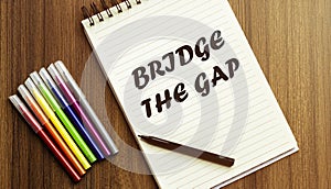 Bridge The Gap. your future target searching, a marker, pen, three colored pencils and a notebook for writing