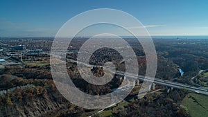 A bridge going over a valley and River