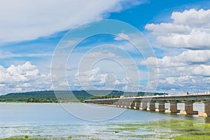 The bridge of Her Majesty Thepsuda,Lam Pao Dam,Kalasin province,Thailand with the beautiful blue sky and cloud.