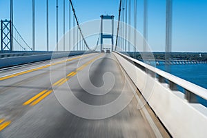 Bridge and highway over water with motion blur