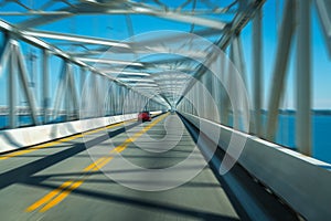 Bridge and highway over water with motion blur