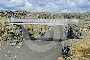 Bridge in Iceland over a fissure in the daytime