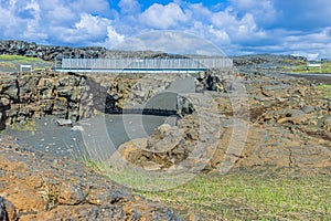 Bridge in Iceland over a North American fissure in the daytime