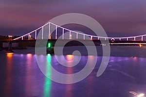 Bridge in Kiev at night, illuminated with colorful lights