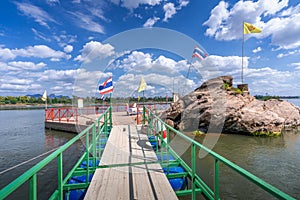 A bridge leading to the Buddha`s Footprint in the middle of the Mekong River in Tha Uthen District, Nakhon Phanom Province,