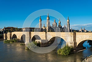 Bridge of lions and the ancient cathedral of Zaragoza