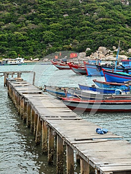 The bridge and many boats the Hon Khoi pier in Khanh Hoa, Vietnam