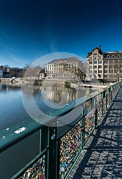 Bridge with many locks symbolizing love in Zurich in Switzerland on the river Limmat