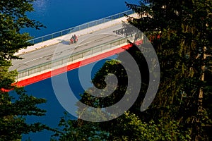 bridge and motorcycle over lake Sylvenstein near village Fall, Bavaria