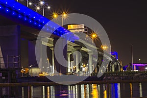 Bridge at night with bridge lights reflection on water