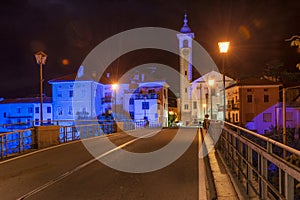 Bridge in night Kanal town in Slovenia