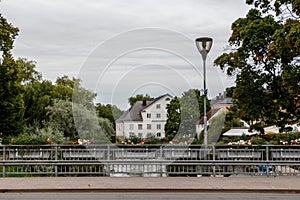 a bridge and old buildings by the river in the center of Uppsala, Sweden