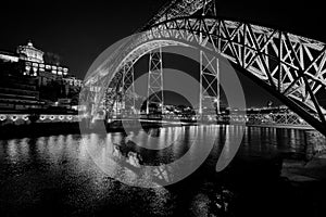 The bridge of the old city of Porto. The streets of Porto at night. Portugal. Black and white