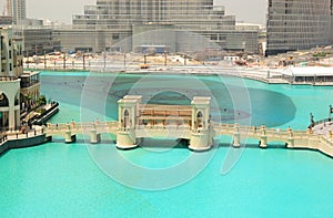 Bridge over artificial lake in Dubai downtown