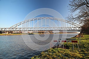 Bridge over canal named Amsterdam Rijnkanaal at Houten in the morning sun. This canal connects harbor of Amsterdam with river Rhin