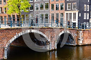 Bridge over channel in Amsterdam Netherlands houses river Amstel
