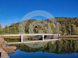 Bridge over Cockle Creek at Bobbin Head Reflected in the Water