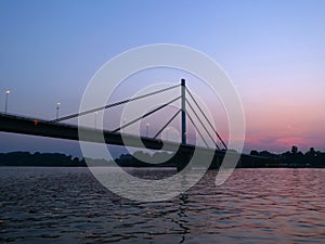 Bridge over Danube river at sunset