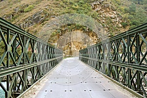 Bridge over deep river in remote himalayas india