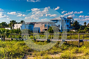 Bridge over dune grasses and beach houses in Vilano Beach, Florida. photo