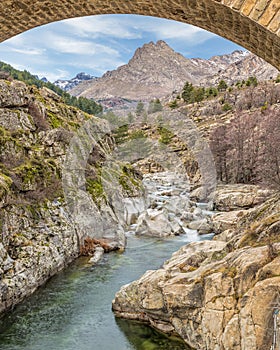 Bridge over Golo river with Mount Albanu in distance