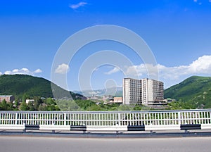 Bridge over the gorge of the Arpa River. View of Gladzor Sanatorium, mountains and blue sky. The city of Jermuk, Armenia