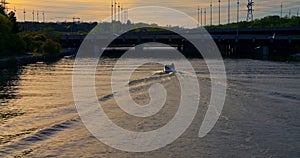 Bridge over lake boat floating at sunset captured from above Sunset on lake bridge and boat in harmony with nature