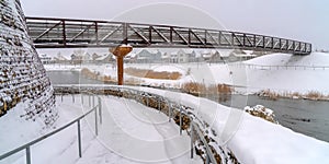 Bridge over lake in snowy Daybreak, Utah