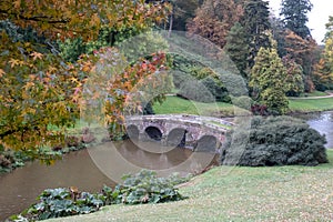 The bridge over the lake at Stourhead National Trust property near Warminster in Wiltshire UK