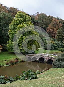 The bridge over the lake at Stourhead National Trust property near Warminster in Wiltshire UK