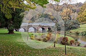 The bridge over the lake at Stourhead National Trust property near Warminster in Wiltshire UK