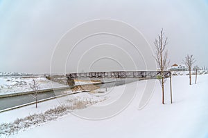 Bridge over lake during winter in Daybreak Utah