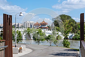 Bridge over a pond in Chinese style on the background of Singapore