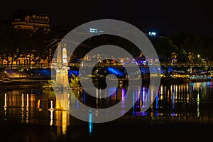 Bridge over Rhone river in Lyon, France at night