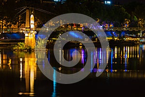 Bridge over Rhone river in Lyon, France at night