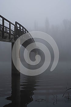 Bridge over the river with fog