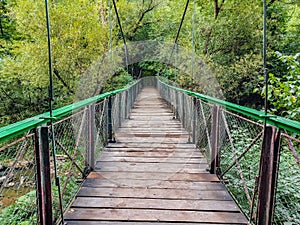 Bridge over the river in the forest - mountain landscape in Cheile Turzii , Romania